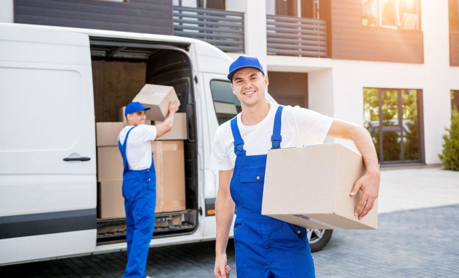 Carstairs movers loading boxes into a moving truck