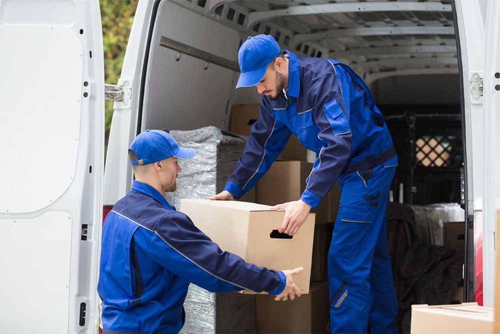 Movers loading boxes into a moving truck in Panorama Hills, Calgary