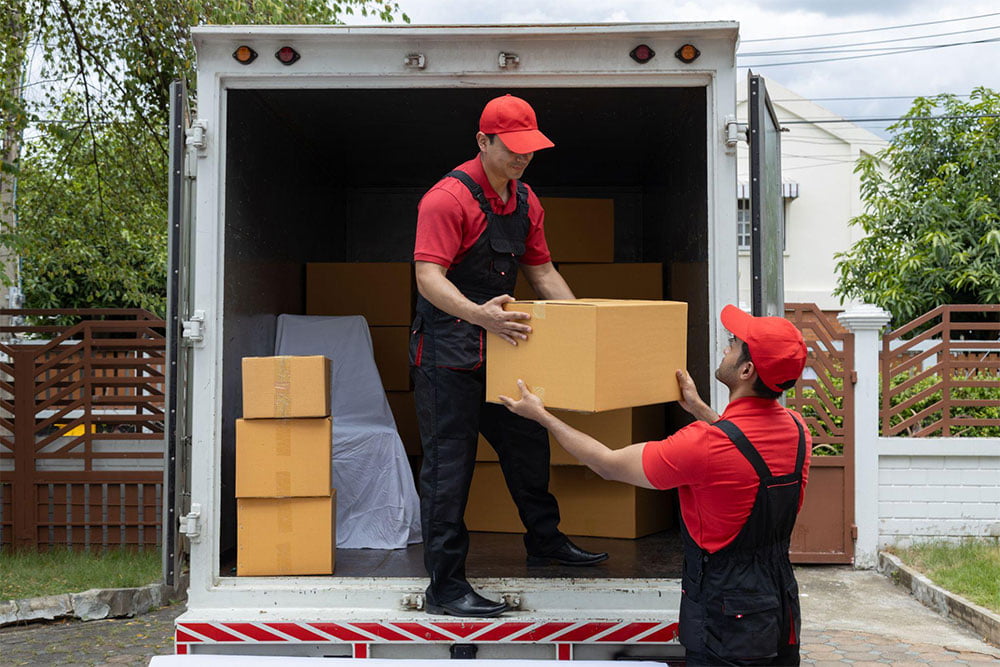 Calgary Movers ABPro movers loading boxes into a moving truck in Brentwood, Northwest Calgary
