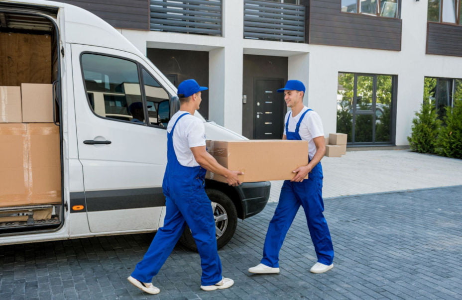 Okotoks movers loading boxes into a moving truck