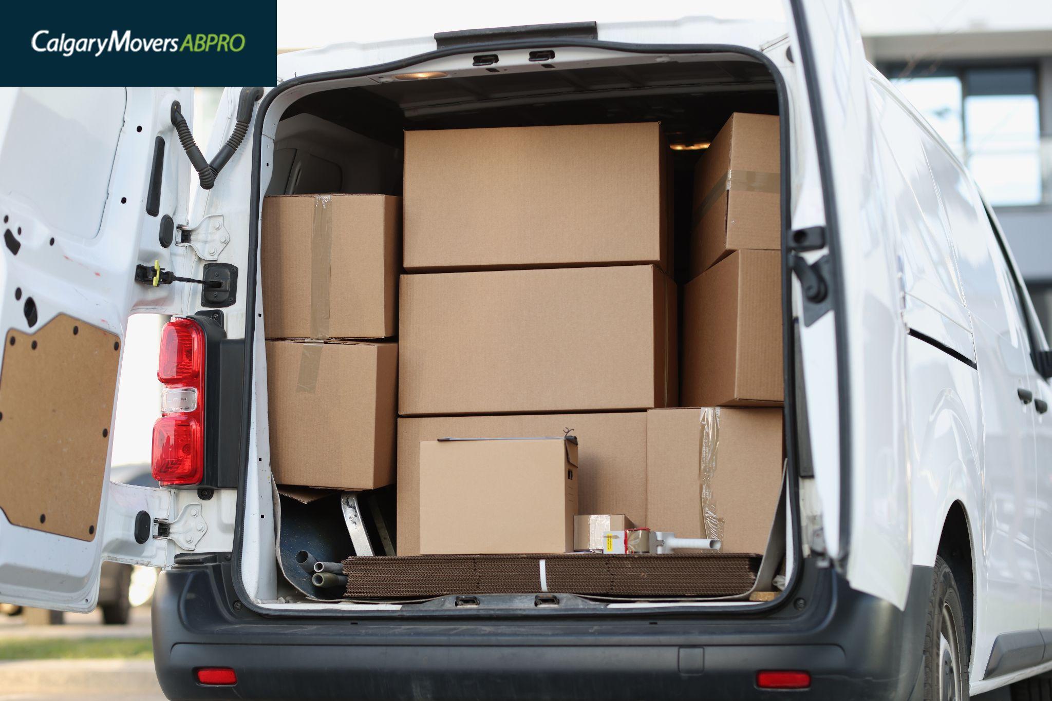 Open van loaded with cardboard boxes, ready for a moving day in Calgary, showcasing an organized and efficient relocation process