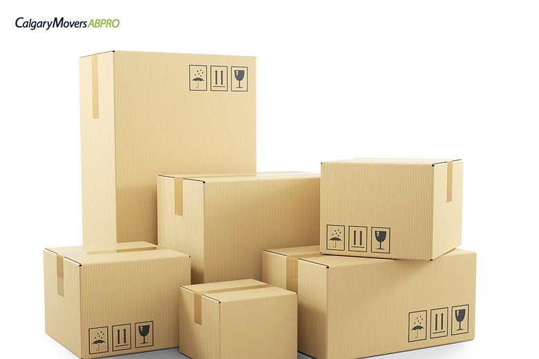Stack of labeled cardboard boxes ready for a move, showcasing organized packing for a seamless relocation experience with Calgary Movers ABPro